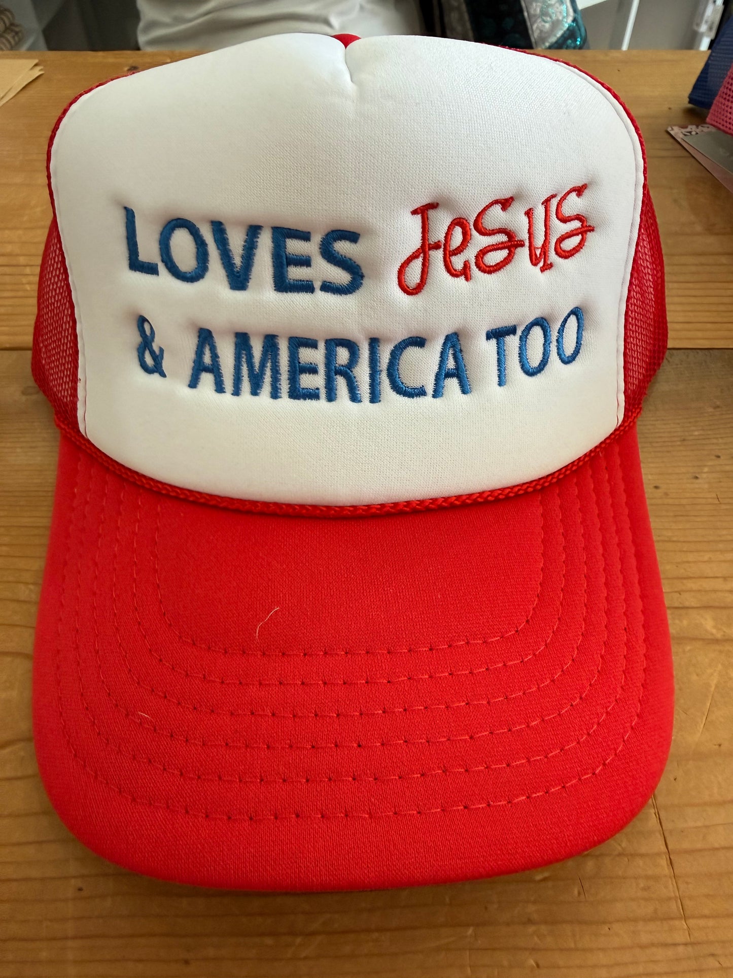 Quilted Stitch Custom Embroidered “Loves Jesus and America Too” Trucker Hat