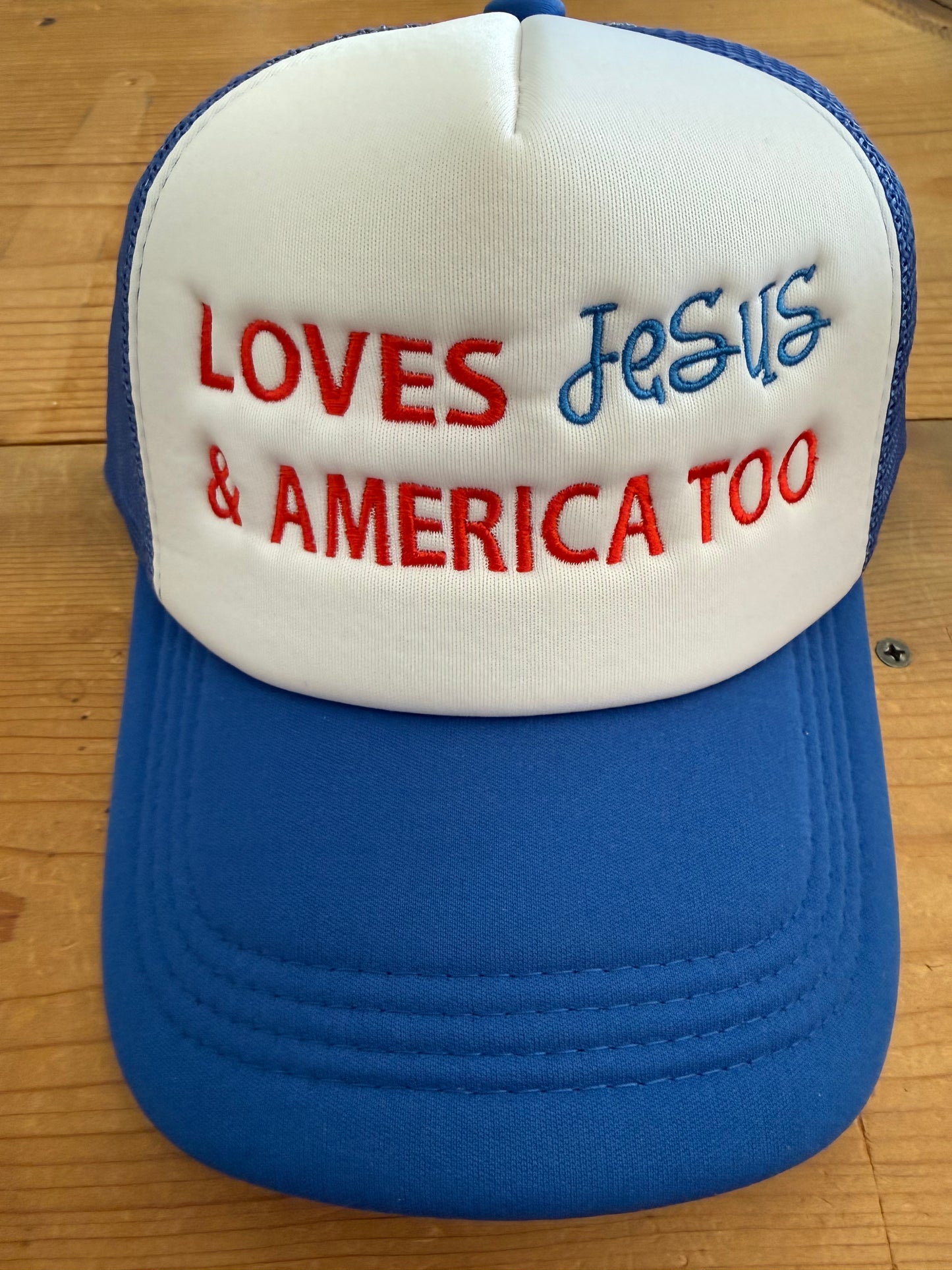 Quilted Stitch Custom Embroidered “Loves Jesus and America Too” Trucker Hat